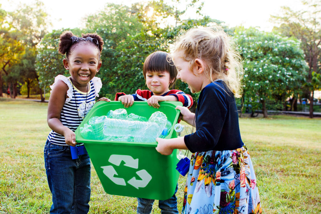 Connection makes us strong, young children cleaning up plastic trash