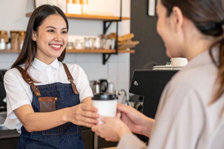 You Never Know Who Needs Your Kindness, barista smiling while talking with customer